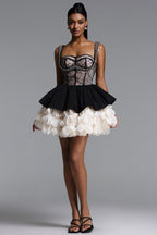 BLACK AND CREAM MINI DRESS WITH A DECORATIVE GORST AND A FLORAL BOTTOM