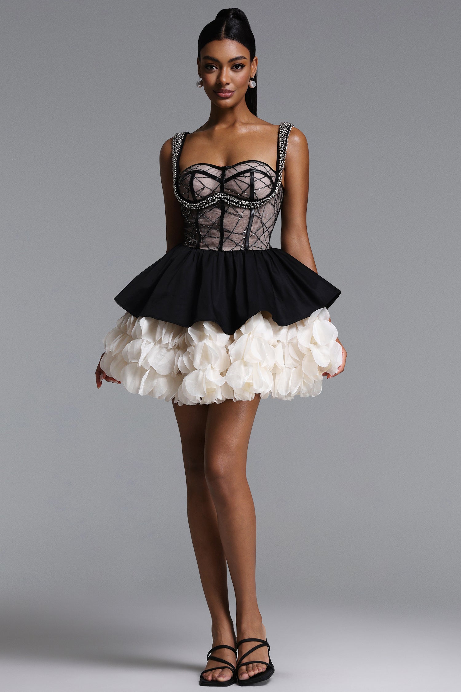 BLACK AND CREAM MINI DRESS WITH A DECORATIVE GORST AND A FLORAL BOTTOM