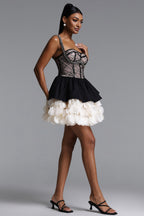 BLACK AND CREAM MINI DRESS WITH A DECORATIVE GORST AND A FLORAL BOTTOM