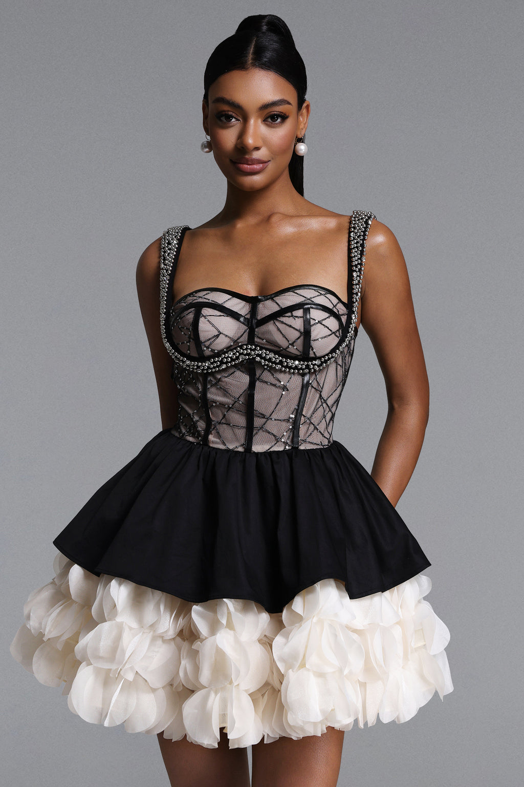 BLACK AND CREAM MINI DRESS WITH A DECORATIVE GORST AND A FLORAL BOTTOM