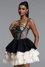 BLACK AND CREAM MINI DRESS WITH A DECORATIVE GORST AND A FLORAL BOTTOM