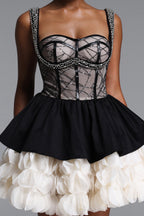 BLACK AND CREAM MINI DRESS WITH A DECORATIVE GORST AND A FLORAL BOTTOM