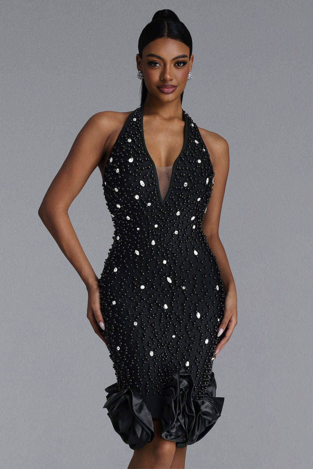 BLACK MIDI DRESS WITH CRYSTALS, DEEP DOCK AND A DECORATIVE BOTTOM