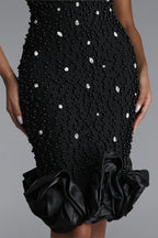 BLACK MIDI DRESS WITH CRYSTALS, DEEP DOCK AND A DECORATIVE BOTTOM