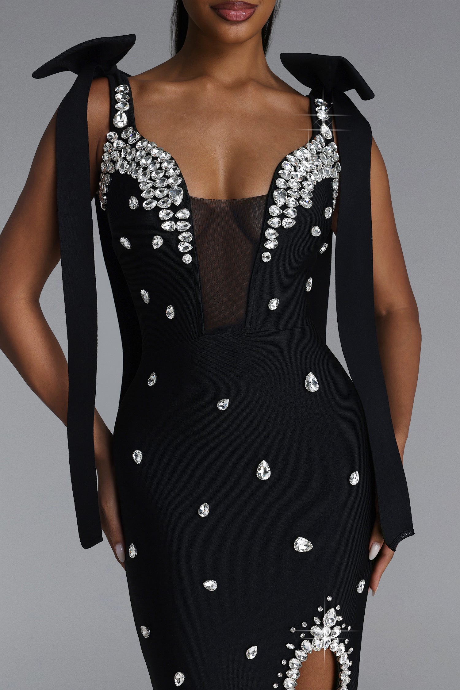 BLACK MINI DRESS WITH CORDS, CRYSTALS AND A DECIMAL V