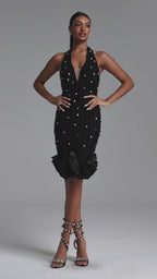 BLACK MIDI DRESS WITH CRYSTALS, DEEP DOCK AND A DECORATIVE BOTTOM