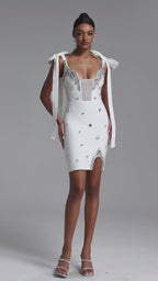 WHITE MINI DRESS WITH CORKS, CRYSTALS AND A DECIMAL V