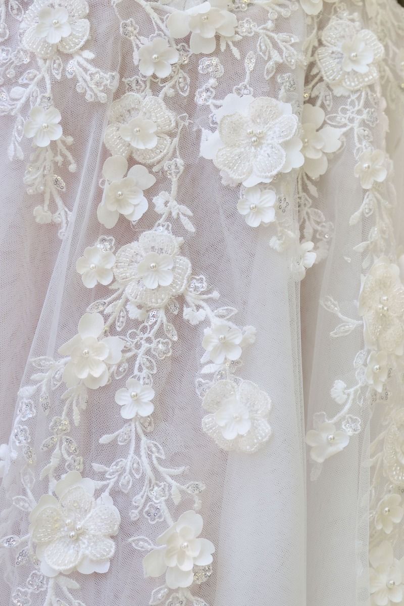 A-line wedding gown plunging illusion neckline and delicate floral straps corset bodice